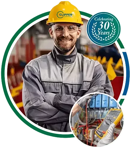 Clipper Controls service and installation engineer wearing a hard hat and using a multimeter instrument to test control boards