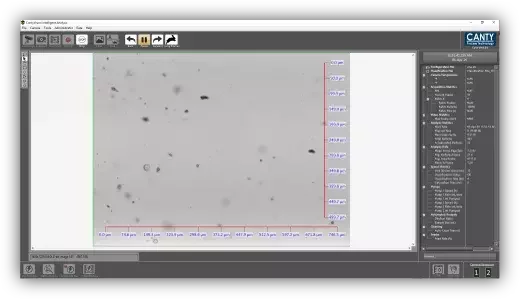 Live imaging software window showing particles in flow with measurement overlays and analysis controls