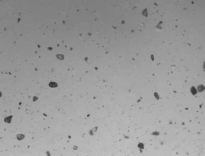 Microscopic grayscale view showing many particles suspended in Water for Injection