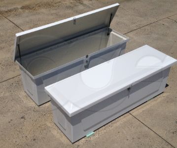 Two redstone fiberglass enclosures, one closed showing the exterior and one with the lid open showing the inside