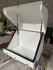 A large gemeni2 water sampler enclosure with a hood supported by gas spring lifts