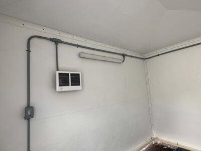 A shelter with wall mounted lights
