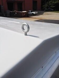 Galvanized lifting eyes attached to the roof of a shelter for lifting purposes