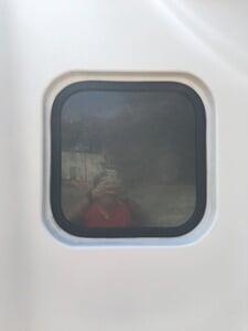A polycarbonate shelter door window
