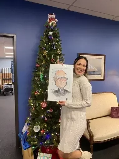 Clipper Controls staff with a Christmas tree in the background