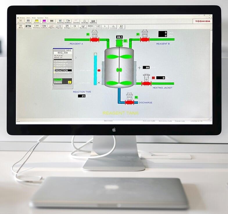 Toshiba HMI display showing process graphics for industrial equipment monitoring and control